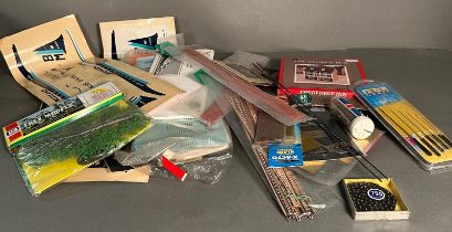 A box of craft accessories to include decals three models and various tools