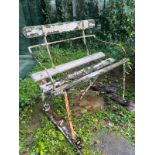 An antique iron garden bench with wooden slats to seat and base (H76cm W81cm D52cm SH43cm) Condition