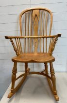 A pine high back Windsor rocking chair