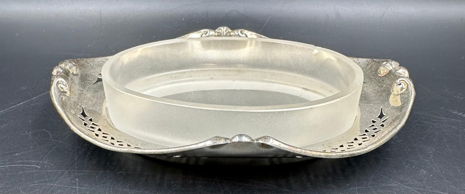 A silver framed glass bowl with pierced decoration, hallmarked for Sheffield 1919 by R F Mosley & Co