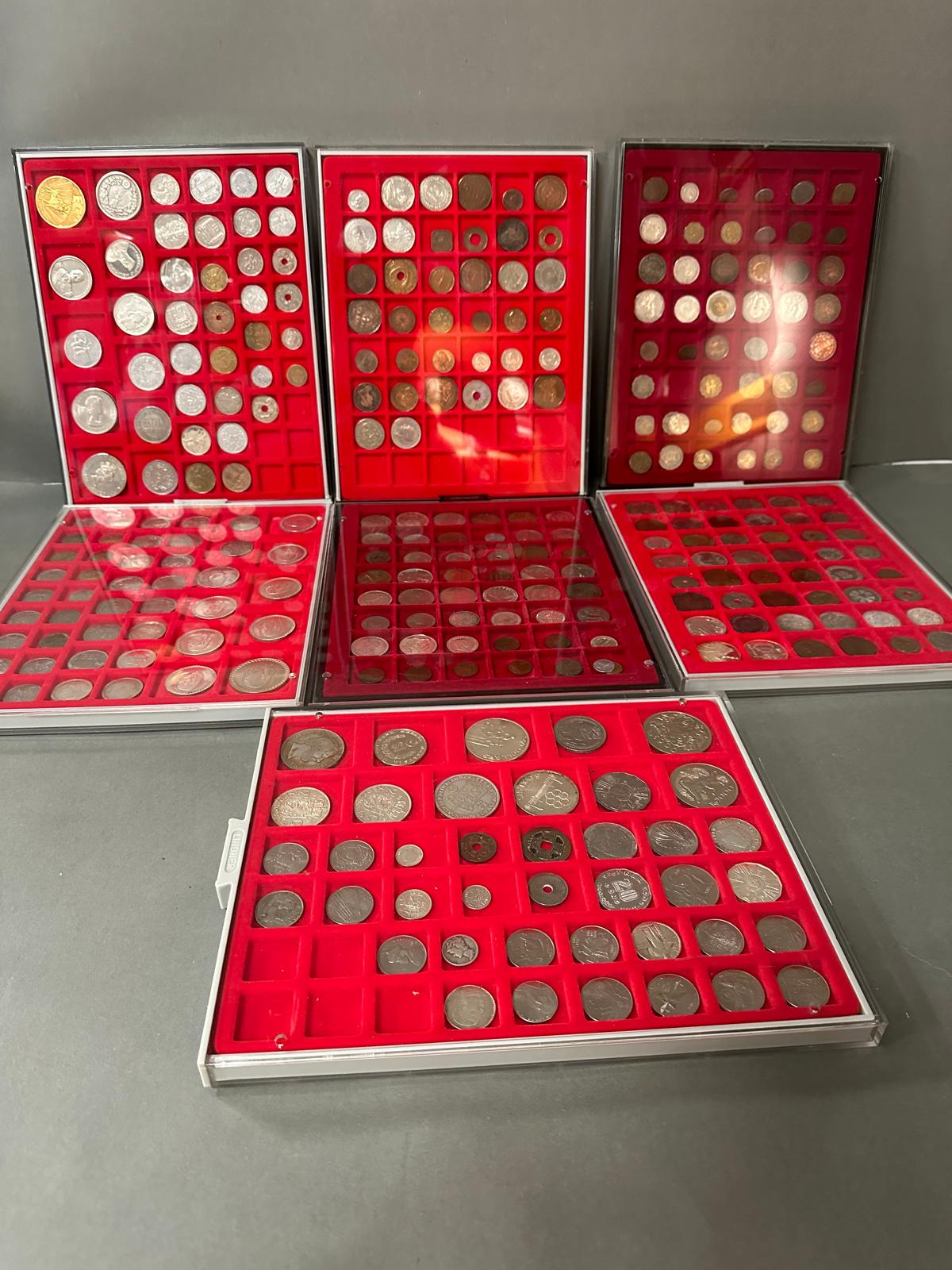 A selection of world coins in seven trays, including Indian, Russian etc.