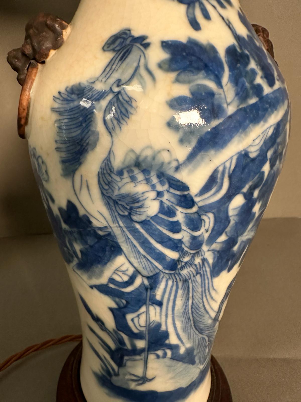 A pair of Chinese blue and white table lamps in a floral bird pattern with foo dogs to side - Image 3 of 8