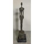 A bronze sculpture of The Grande Donna on a marble plinth and signed Giacometti to base H44cm