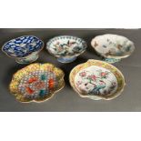 A selection of five antique Chinese bowls on a stem foot