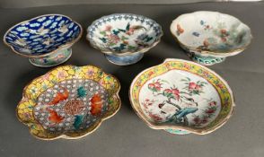 A selection of five antique Chinese bowls on a stem foot