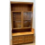 A Mid Century wall cabinet by Nathan, comprising of two door glazed cupboards, two door cupboard