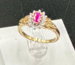 A 9ct gold ruby and diamond ornate ring in yellow gold setting, approximate size O1/2