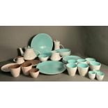 A part pool pottery breakfast set in browns and green and white to include cups, saucers, egg cups