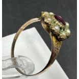 A 9ct gold daisy style ring with central ruby and seed pearls, approximate size Q and weight 2.2g