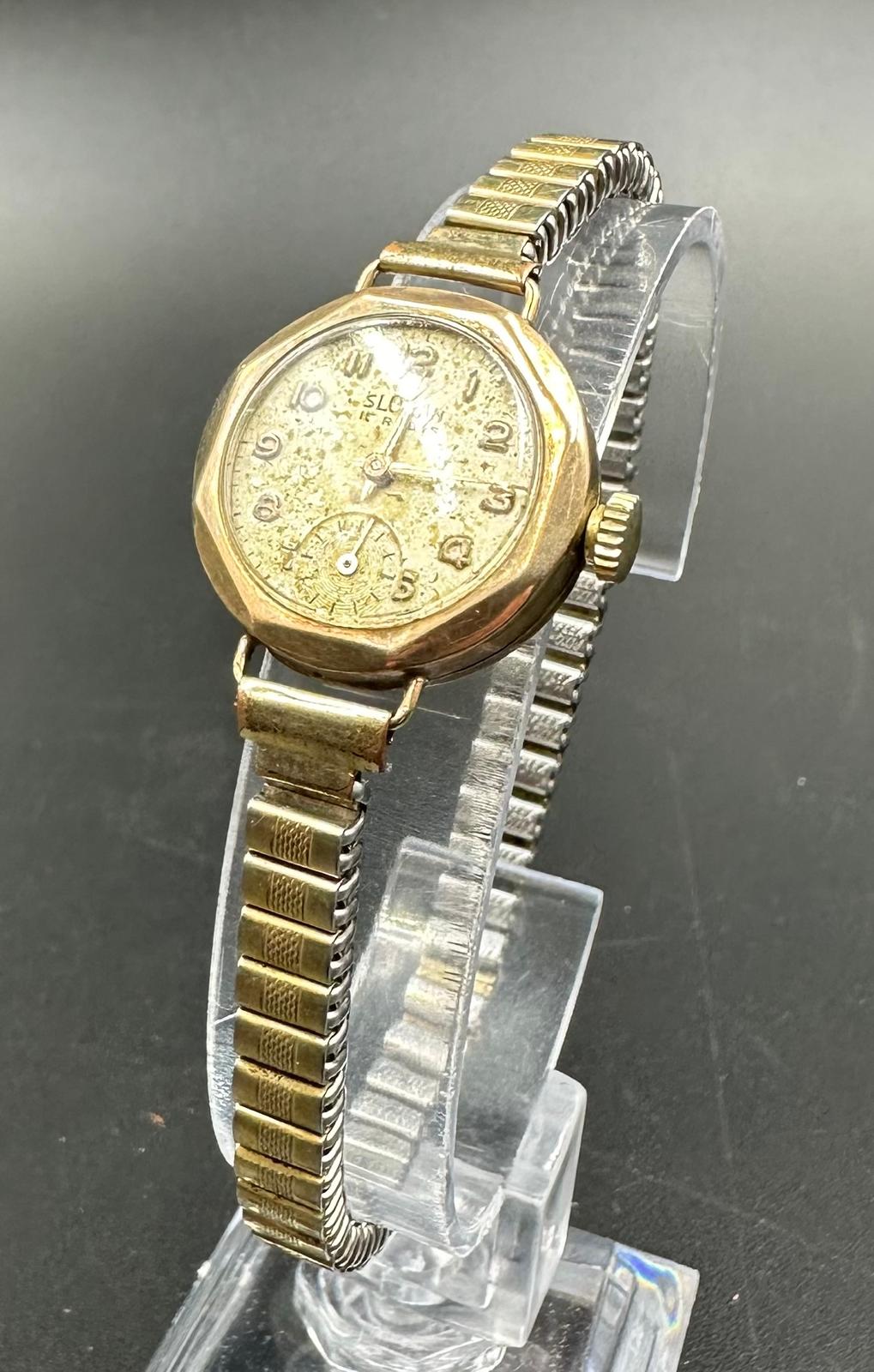 A 9ct gold watch on a stainless steel bracelet