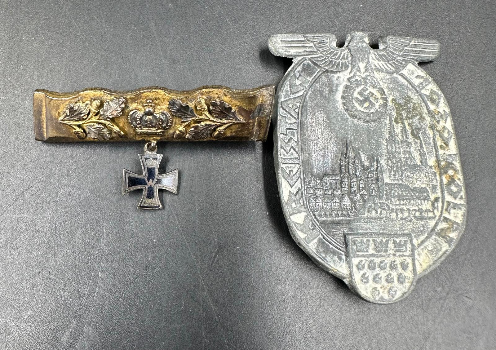 A German 1939 Kreistag Koln tinnie, along with a German WWI commemorative.