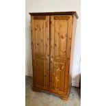 A pine double wardrobe by Ducal (H192cm W98cm D61cm) Condition Report Wear and scratches throughout,