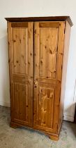 A pine double wardrobe by Ducal (H192cm W98cm D61cm) Condition Report Wear and scratches throughout,