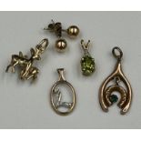 A selection of five 9ct gold items to include, charm, pendants earrings with a combined total weight