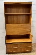 A Mid Century Nathan bookcase bureau with two door cupboard under, fall opening to reveal desk