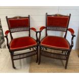 A pair of salon chairs with satinwood inlay on castors.