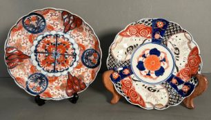 Two Japanese plates in the Imari palette in reds, blues and black