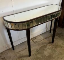 A mirrored console table on tapering legs (H77cm W110cm D35cm)