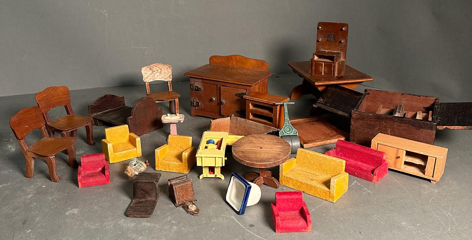 A selection of vintage dolls house furniture to include chairs, sideboard and wardrobe