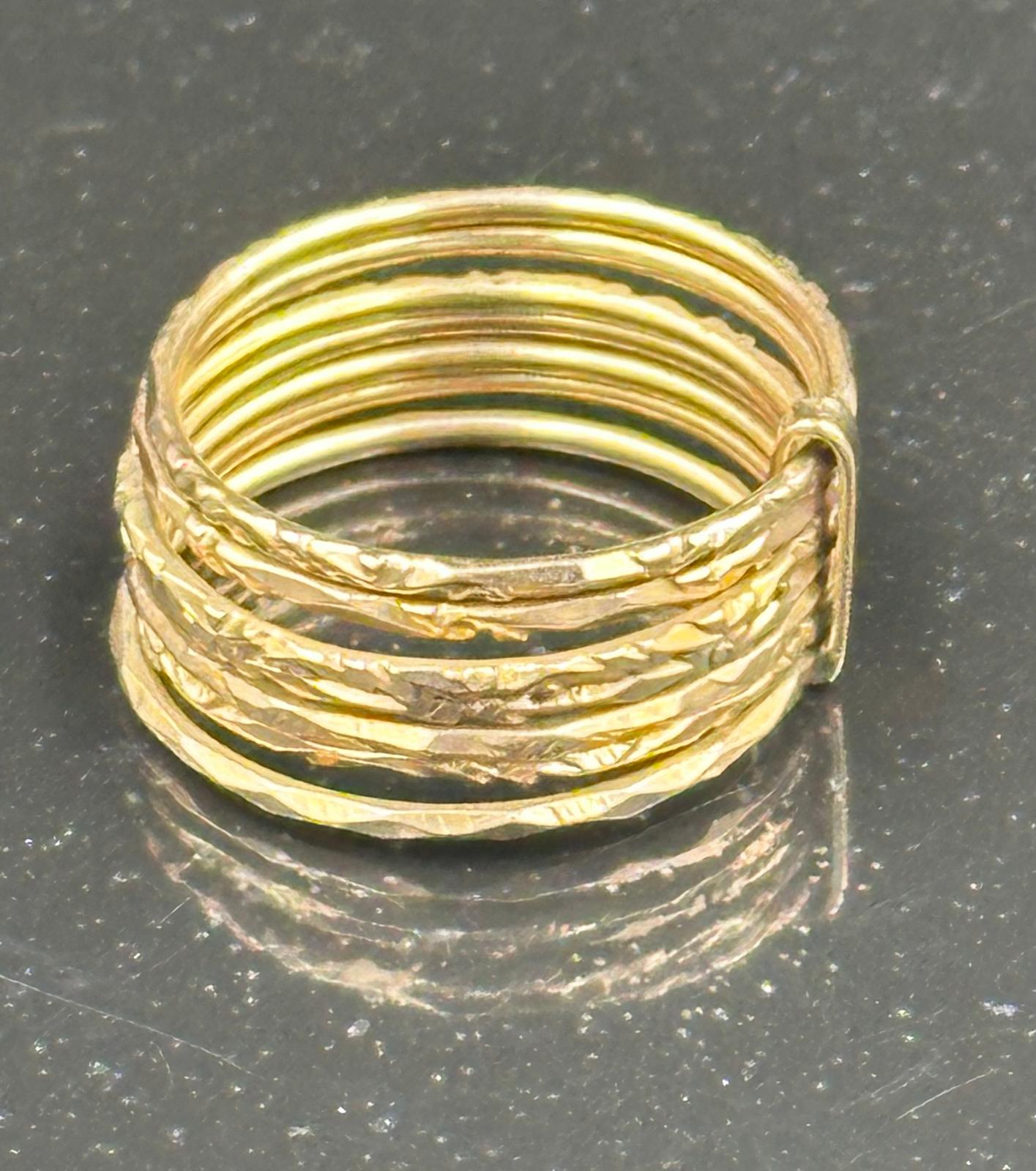 A 14ct gold fashion ring with multiple fine rings, approximate weight 3g