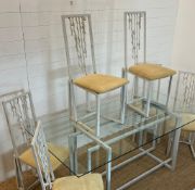 A large glass and metal framed table with six high back chairs (H74cm W180cm D90cm)