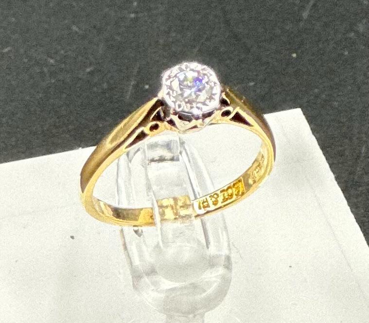 An 18ct yellow gold and platinum set diamond ring, approximate size J1/2