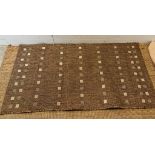 A beige rug by Dunelm 80cm x 150cm