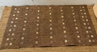 A beige rug by Dunelm 80cm x 150cm