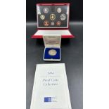 A Royal Mint 1994 Proof Coin Collection along with a 1972 Olympic !0 Deutsche Mark coin in