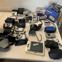 A collection of compac cameras including Sony, Olympus, Fujifilm etc