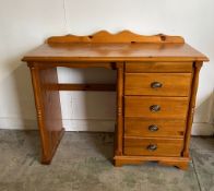 A pine desk or dressing table (H79cm W106cm D46cm)