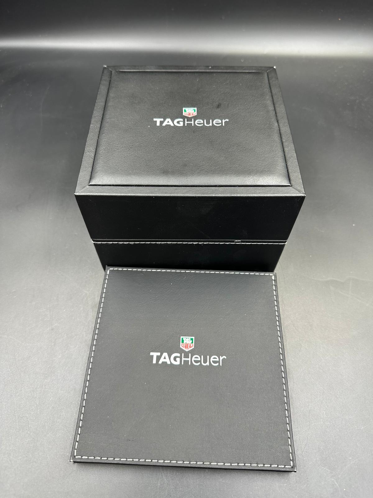 A Ladies Tag Heuer Formula 1 watch with diamond bezel, box and papers on pink leather strap with