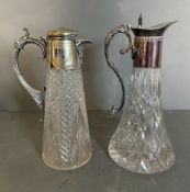 Two cut glass claret jugs with scrolling silver plated handles