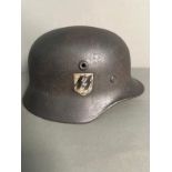 A WWII Waffen SS Field Helmet, with liner