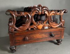 A Victorian carved rosewood Canterbury on turned feet with single drawer under. (53cm x 37cm x