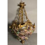 A Murano gilt brass and coloured glass chandelier in pinks, greens and purple.