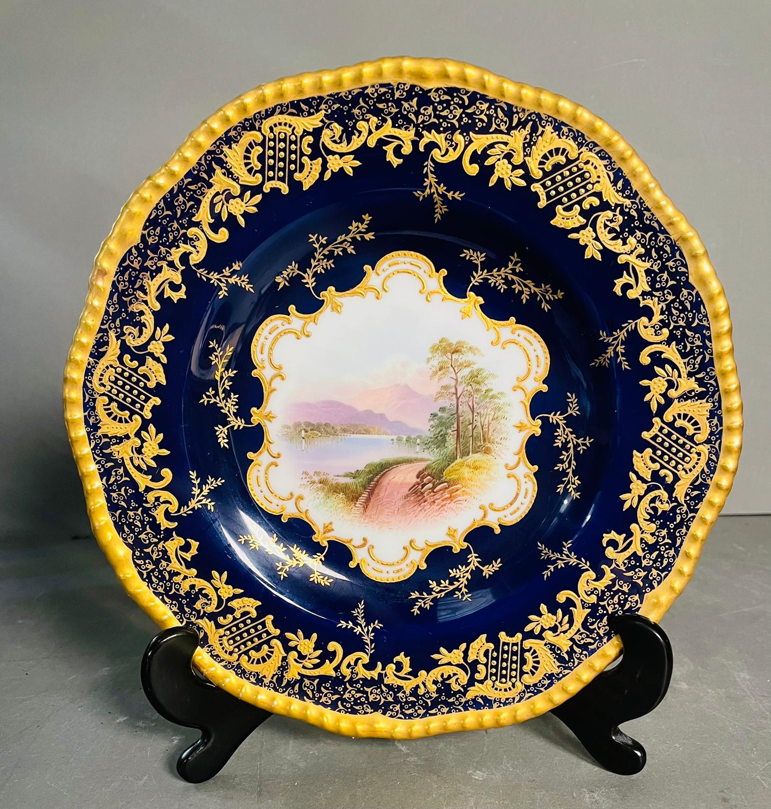 A selection of five early 20th century Coalport hand painted plates with blue grounds, under an acid - Image 9 of 12