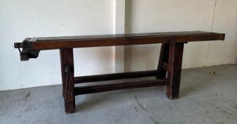 A vintage oak work bench with cast iron vice handles and an A frame base with cross stretcher (H79cm