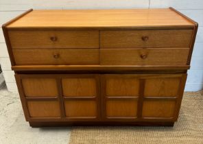 A Mid Century sideboard by Nathan, four short drawers with two cupboard door under (H76cm W122cm