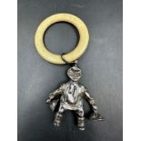 An antique silver babies rattle by Crisford & Norris Ltd, hallmarked for Birmingham 1931