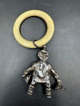 An antique silver babies rattle by Crisford & Norris Ltd, hallmarked for Birmingham 1931