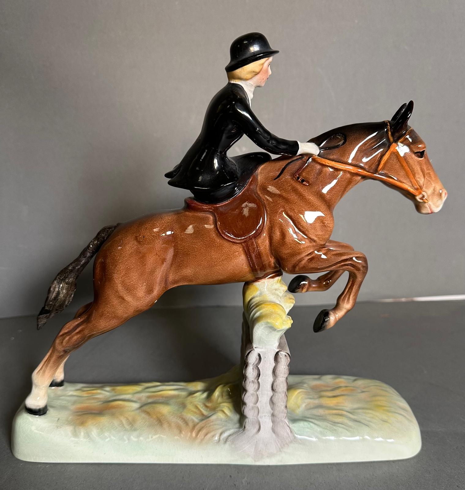 A Beswick figure of a lady riding a hunter AF