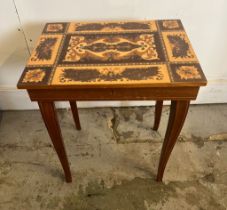 An Italian Sorrento table, opens to lined interior