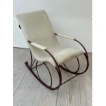 A late Victorian rocking chair, upholstered later (H92cm W102cm D53cm)