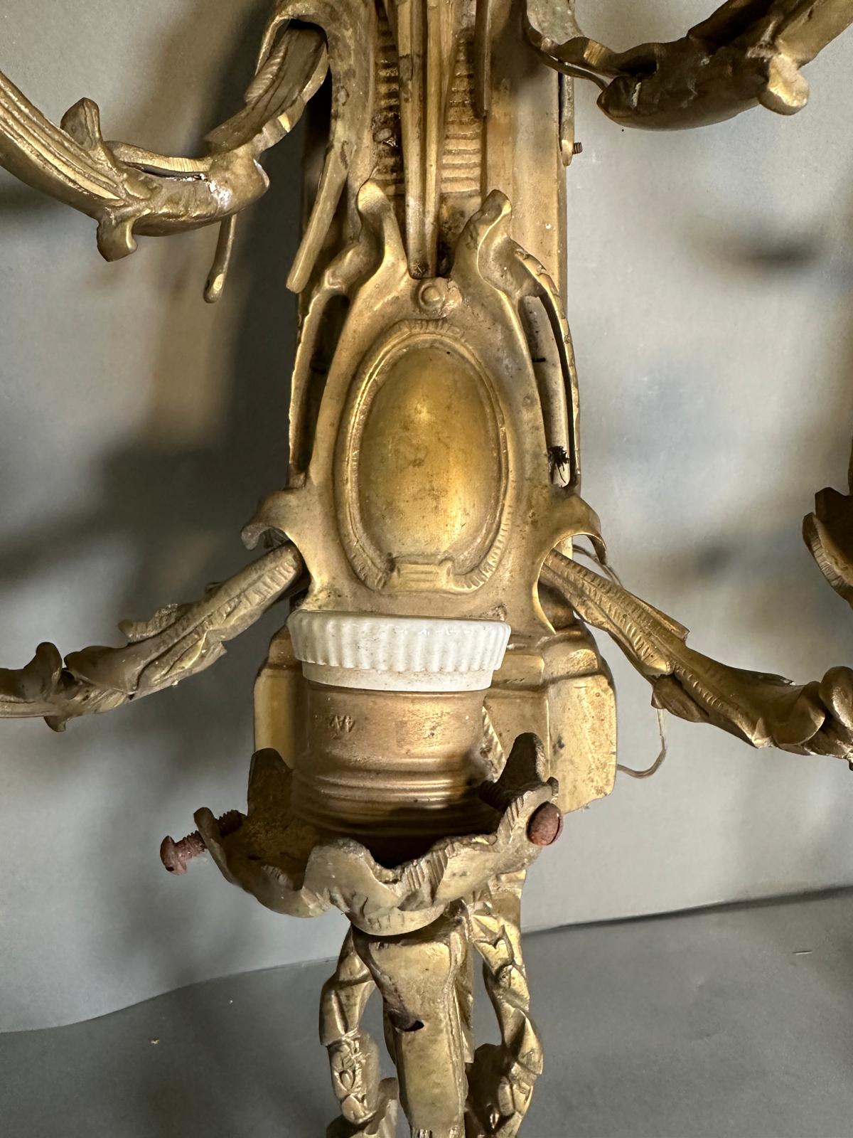 A pair of brass Louis XVI style five arm wall sconces - Image 5 of 5