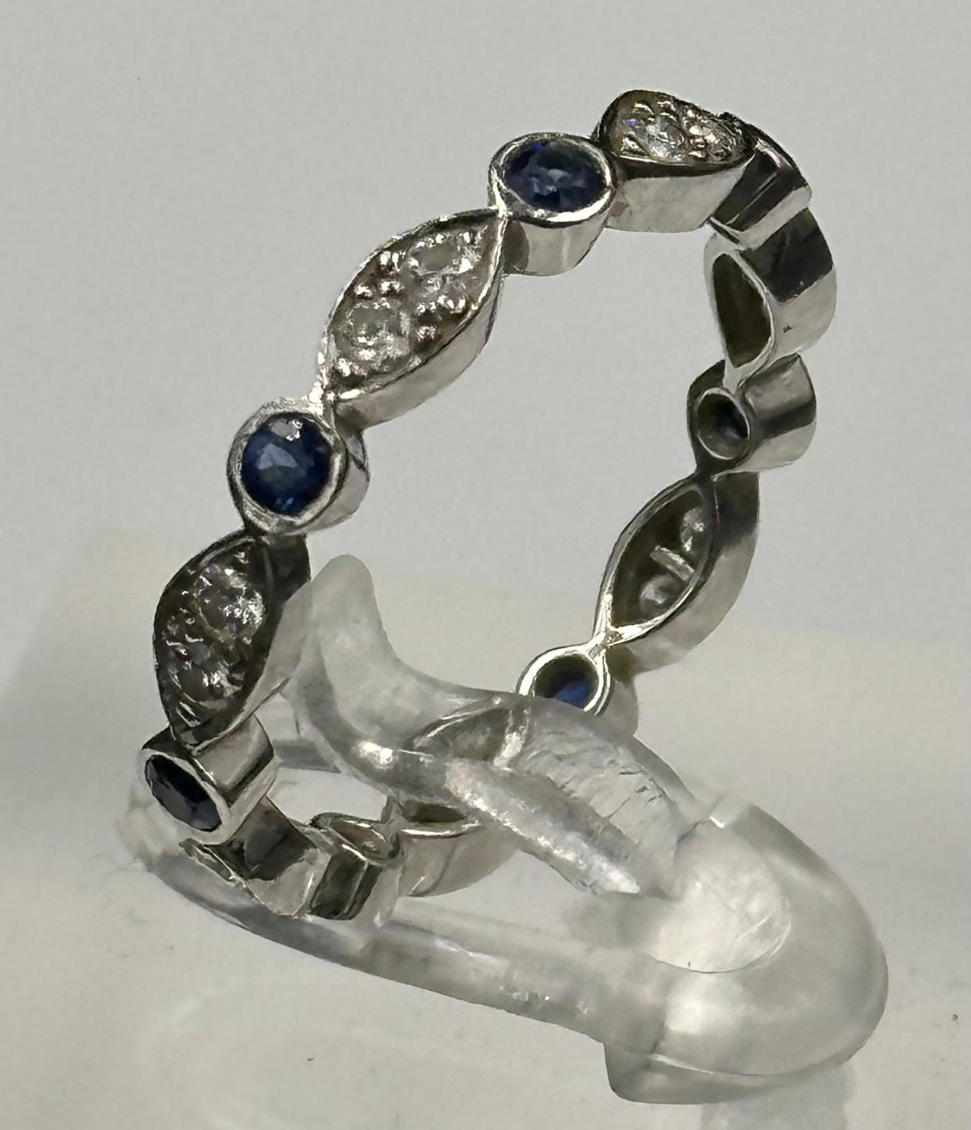 Sapphire and round diamond eternity ring mounted in platinum. Signed T&C 950. Total diamond weight - Image 2 of 3