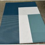 A contemporary rug in blue, green and beige 200cm x 250cm