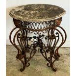 A French marble topped circular table with scrolling iron twin legs (H78cm Dia66cm)