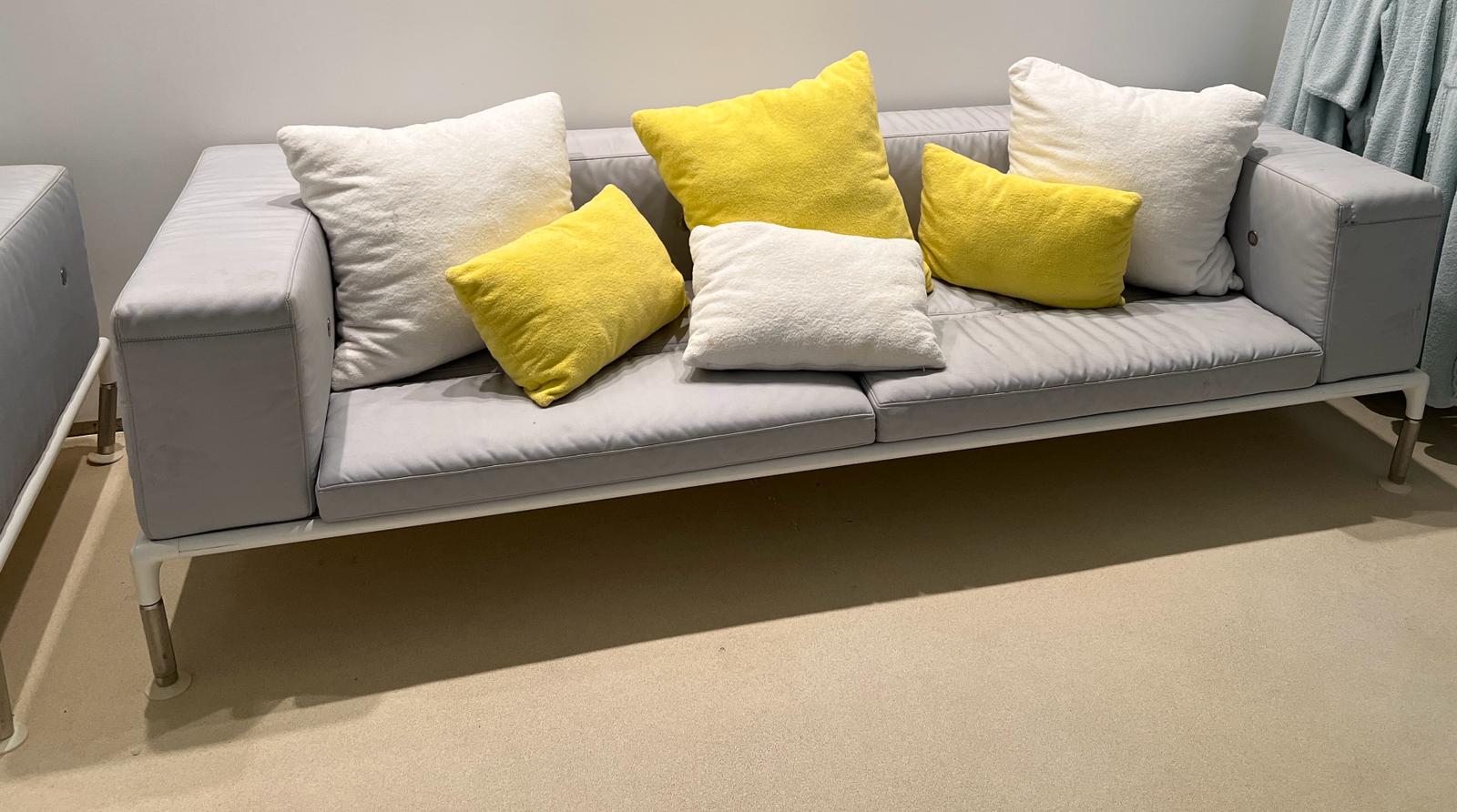 A grey outdoor sofa by B & B Italia outdoor springtime (H73cm W260cm D97cm)