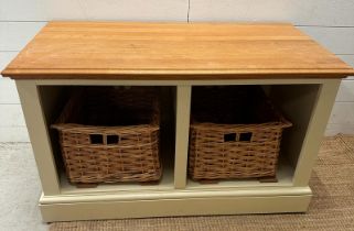 A pine topped painted shoe bench with twin wicker storage baskets (H62cm W105cm D56cm)